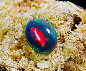 พลอยโอปอลแท้สีดำของชาวเอธิโอเปียอัญมณีโอปอลไฟกาแลคซีพลอยขัดเงาเรียบรูปไข่ทรงรีเอธิโอเปียนโอปอลทรงหลังเบี้ยสีดำ - Product Image 6