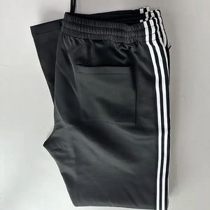 Servicio OEM de alta calidad Pantalones de chándal de pierna ancha de primavera personalizados Pantalones de chándal de punto de secado rápido transpirables de ajuste holgado a rayas - Product Image 4