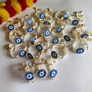 Hermosos diseños de Moti, brazaletes con patrón de mal de ojo, hermosa perla Kundan, trabajo étnico para boda y devolución, brazalete de hilo de recuerdo - Product Image 1
