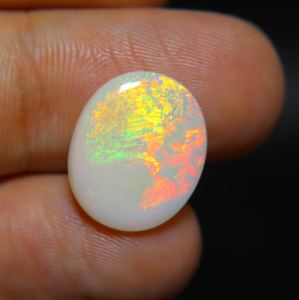 อัญมณีโอปอลคาร์โบชองธรรมชาติสำหรับทำเครื่องประดับอัญมณีหลายไฟทรงรีตัดเป็นรูปวงรีขนาด5.00กะรัตจากออสเตรเลีย - Product Image 2