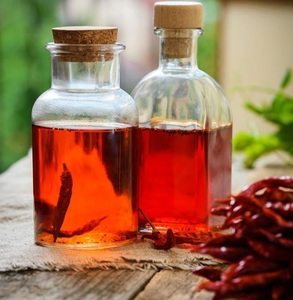 Huile de graines de piment 100% pure, naturelle et pressée à froid pour des applications thérapeutiques et cosmétiques | Fournisseur en vrac en gros - Product Image 1