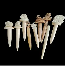 custom made bone hair sticks with hand carved designs of roman soldiers , eagles and animals ideal for resale by hair accessory