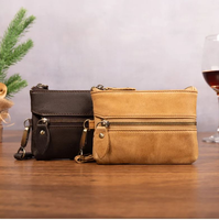 Porte-clés élégant et compact en cuir véritable de haute qualité avec fermeture à bouton-poussoir, doublure lisse et blocage RFID