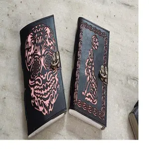 custom made laser cut leather journals with multi colored deckle edged handmade paper pages for resale by book stores in brown