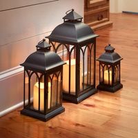 Lanternes métalliques décoratives antiques élégantes noires avec finition cuivrée, parfaites pour les intérieurs rustiques, les maisons de campagne