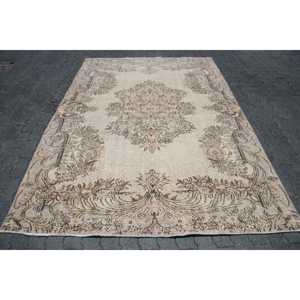 Turkish Vintage Rug 6.2x8.9 ft, <b>Brown</b> Animal Print <b>Wool</b> Rug - Product Image 1