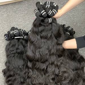 Top vente 2024 100% vierge naturel ondulé cheveux bruts faisceaux Extensions de cheveux Machine Double trame cuticule aligné prix de gros - Product Image 3