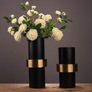 Modern <b>Black</b> and Gold Decorative <b>Vase</b> metal with a matte <b>black</b> finish and a polished gold-toned metallic band around the center. - Product Image 3