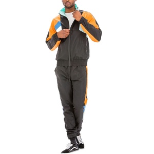 ชุดวอร์มกันลมแบบ 2-in-1 สำหรับฤดูหนาว ผ้าฝ้าย 100% น้ำหนักเบา กันน้ำ พิมพ์โลโก้ได้ตามต้องการ  แบบสปอร์ตสำหรับทุกเพศ  บุผ้าฟลีซระบายอากาศได้ดี - Product Image 1