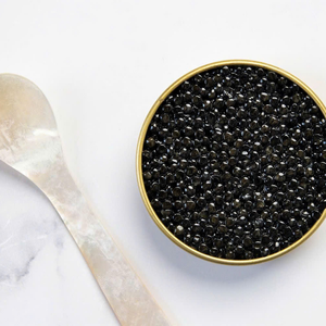 Cuchara de caviar de nácar de lujo con acabado pulido, ideal para comedor gourmet y vajilla elegante - Product Image 1