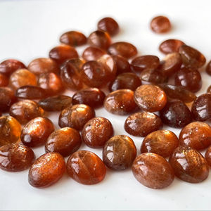 หินซันสโตนธรรมชาติทรงรีทรงหลังเบี้ยทรงรีขนาด7x9มม. AAA - Product Image 1