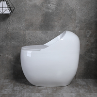 Toilettes en céramique blanche en forme d'œuf à chasse d'eau à jet moderne avec siphon en S pour salle de bain