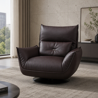 Fauteuil de salon moderne en cuir écologique, pivotant, avec structure en fer moulé sur mesure et pieds en acier carbone.