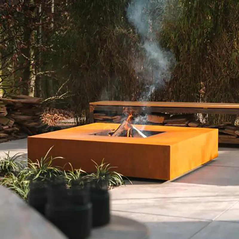 โต๊ะดับเพลิงทรงสี่เหลี่ยมทรงกลมทำจากเหล็กคอร์เทนสำหรับกลางแจ้งสวนเตาไฟไม้แบบตั้งฟรี