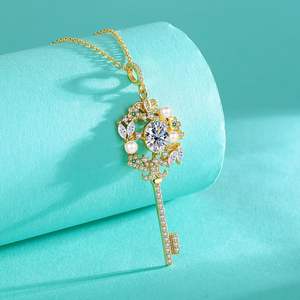 สร้อยคอเงินแท้ 925 ชุบทอง 18K ประดับมอสซาไนต์รูปไข่ ดีไซน์เรียบหรู พร้อมจี้รูปไข่มุก - Product Image 1