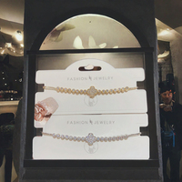 Bracelet de fête élégant unisexe en acier inoxydable plaqué or 18 carats avec breloque papillon et cœur en zircon, idéal pour les couples - Collection Love Bow MoLin