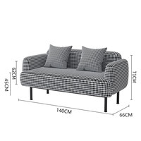 Fauteuil de salon simple à motif pied-de-poule, design unique, avec dossier et accoudoirs, idéal pour salon de manucure ou détente