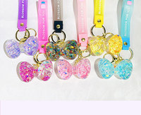 Couple Cadeaux Poupée Sac Clé Pendentif Quicksand Bouteille Porte-clés Liquide Huile Coulant Sable Bulle Perles Arc Liquide Porte-clés