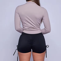 Veste athlétique d'entraînement pour femmes OEM veste de course courte à fermeture éclair légère et coupe ajustée avec trous pour les pouces