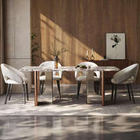 Table de salle à manger contemporaine haut de gamme en pierre frittée écologique avec piétement métallique bicolore pour villa de luxe