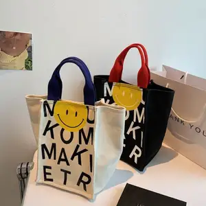 Lächeln niedlichen Einkaufstasche Cartoon Tasche Leinwand benutzer definierte Logo Männer Frauen Student Handtaschen