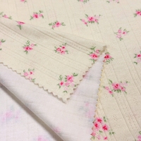 Tissu jacquard côtelé à pointelle imprimé de petits motifs floraux jaunes en maille 95% polyester 5% élasthanne OEKO-TEX pour vêtements de détente et pyjamas