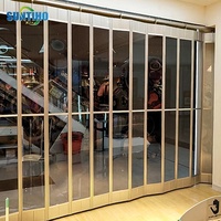 Vente en gros de porte électrique en alliage d'aluminium pour l'intérieur, avec volet roulant en cristal, porte coulissante pliable pour centre commercial, fabricant