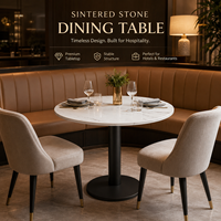 Table de bistrot ronde en pierre frittée avec base métallique stable, design minimaliste pour cafés, hôtels et restaurants