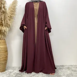 Moyen-Orient Dubaï OEM personnalisé femmes musulmanes robe poignets élastiques long moyen plissé ourlet et poche Cardigan Abaya