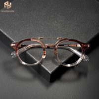 Monturas de Gafas DELAGE Artisan de Titanio y Acetato, Color Rojo Degradado a Oro Rosa, Diseño Redondo Retro, Gafas Ópticas para Uso Diario