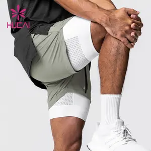 Tasche a doppio strato foderate OEM sport atletici nylon logo personalizzato allenamento da 5 pollici 2 In 1 pantaloncini da palestra da uomo per uomo