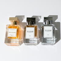 Bouteille de parfum à sertir unique personnalisée pour hommes Bouteilles vides de parfum de 100ml Bouteille de parfum en verre de luxe carrée transparente de 50ml avec bouchon en zamac