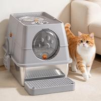 Bac à litière pour chat à commande manuelle avec couvercle rabattable en acier inoxydable, structure double couche anti-odeurs et rideau d'entrée.