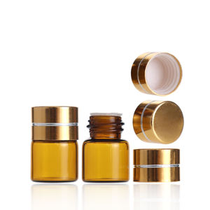 Pequeño frasco redondo de vidrio ámbar para aceites esenciales, cosméticos, vacío, de 1 ml, con tapa de rosca de aluminio dorado y plástico. - Product Image 5