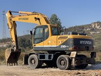 Excavatrice sur pneus Hyundai 210W-9 d'occasion de 20,5 tonnes avec moteur diesel, moteur à engrenages et pompe à vendre