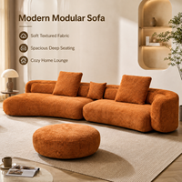 Sofa Modular Boucle Warna Oranye Terang dengan Kain Bertekstur Lembut, Bantalan Dalam yang Luas, Siluet Melengkung, Termasuk Ottoman yang Serasi untuk Rumah