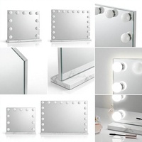 Miroir de maquillage rectangulaire éclairé avec bordure à ampoules et cadre blanc