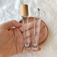 Rouleau de parfum avec LOGO personnalisé bouteille de 10ml en verre épais carré mince avec couvercle en bambou et rouleau en acier métallique pour huiles essentielles