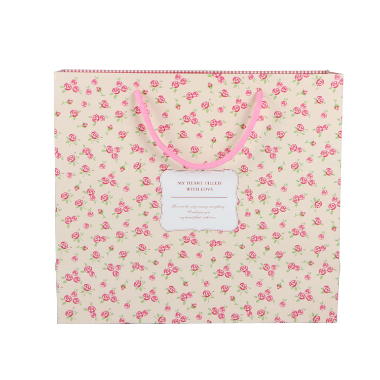 Pink eco friendly luxury paper packing bag for gift jewelry with ribbon handle