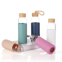 Bouteille d'eau de voyage en verre écologique anti-fuite de 550 ml avec manchon en silicone à visser et couvercle en bambou