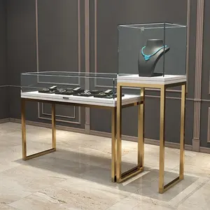Vitrina de acero inoxidable con diamantes, vitrina de exhibición de joyería de vidrio moderna personalizada para tienda