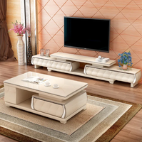 Combinaison de table basse de meuble TV en marbre est moderne, simple et rétractable.