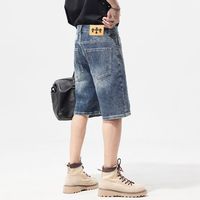 Jeans décontractés pour hommes à la mode de rue jambe large demi-pantalon bas court design baggy