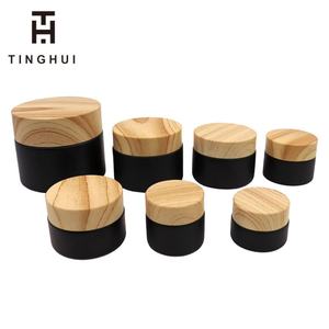 ขวดครีมแก้วฝาปิดลายไม้สีดำด้าน ขนาด 5/10/15/20/30/50 กรัม พร้อมฝาไม้ สำหรับใส่ครีมบำรุงผิวหน้า ภาชนะบรรจุภัณฑ์เครื่องสำอาง - Product Image 1