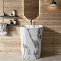 Vente en gros usine à prix compétitif : Lavabo sur pied en pierre frittée polie, forme ovale, blanc, aspect marbre, disponible en différentes tailles