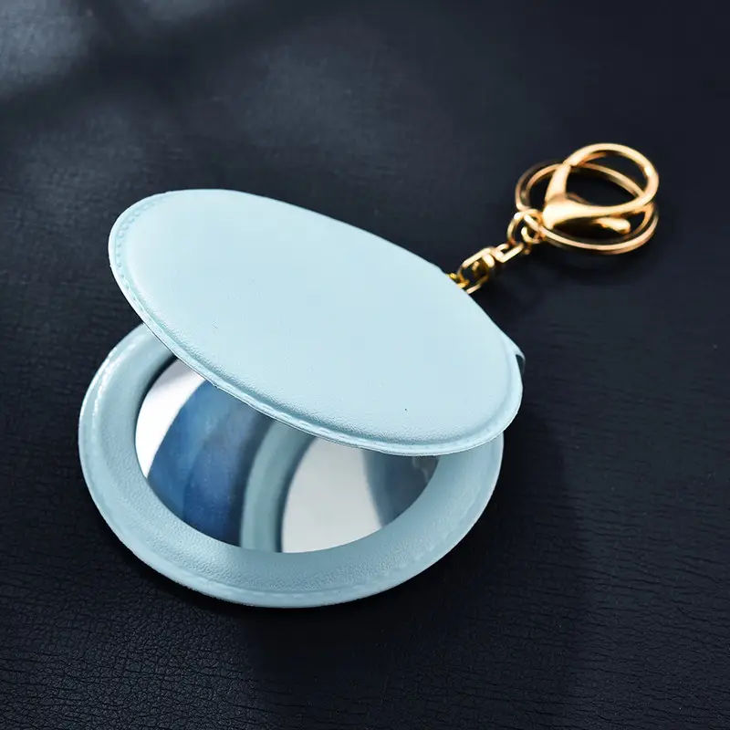 메이크업 미러 PU 작은 라운드 미러 키 체인 양면 접이식 거울 장식 메이크업 프로모션 선물 사용자 정의 로고 키 체인