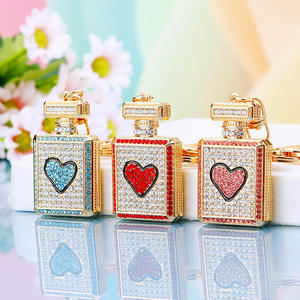The Fashionable and Elegant Bow, Crystal Rhine Stone Perfume Bottle and Metal Keychain Are Charming Pendants for Women and Girls