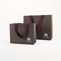 Sac d'emballage pour vêtements de vente au détail GLAMPKG, recyclable, respectueux de l'environnement, en papier texturé enduit avec poignée en ruban