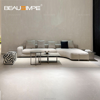 Canapé modulable italien moderne en tissu personnalisable, au design minimaliste et élégant pour salon.
