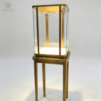 Vitrine moderne en verre et acier inoxydable avec éclairage LED et design rotatif pour magasin de détail